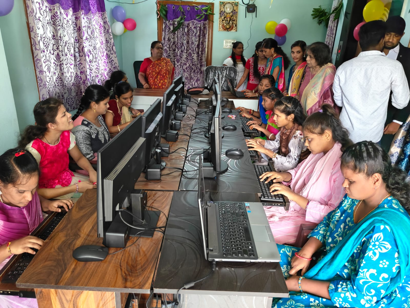 A community group seated for an Annadhanam meal