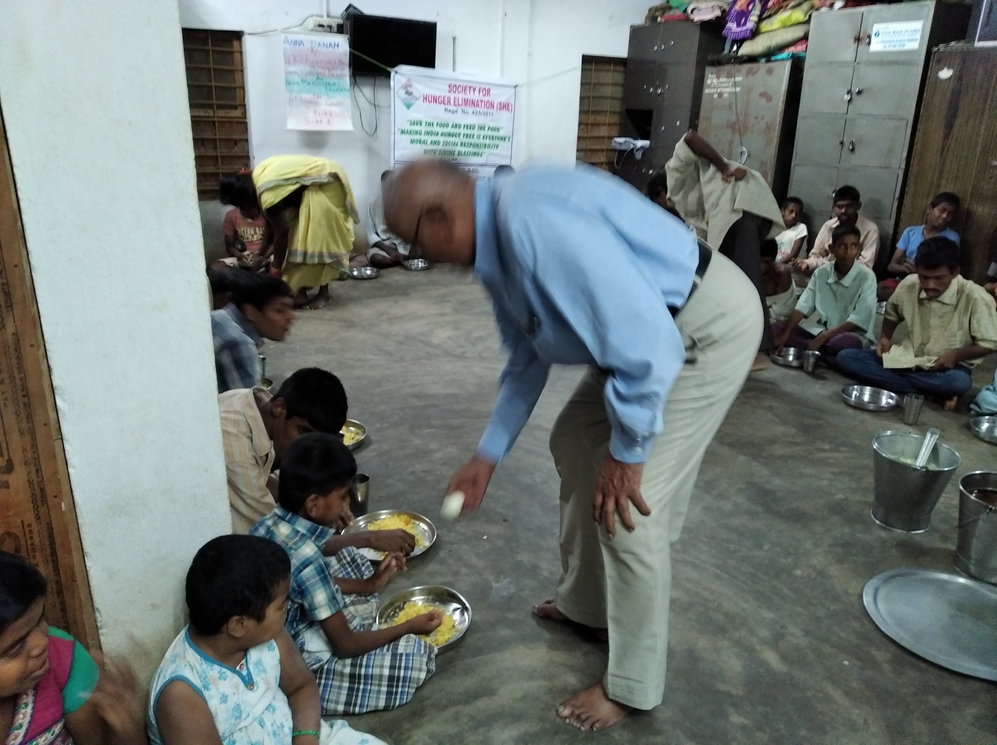 SHE volunteer meeting a family during a home visit
